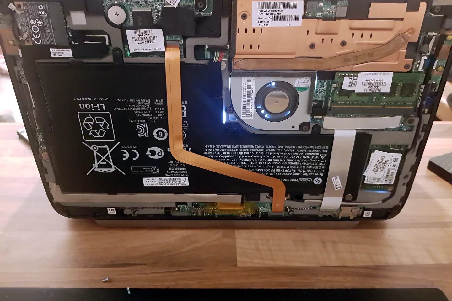 Laptop motherboard exposed for repair diagnosis serving Kingstanding customers