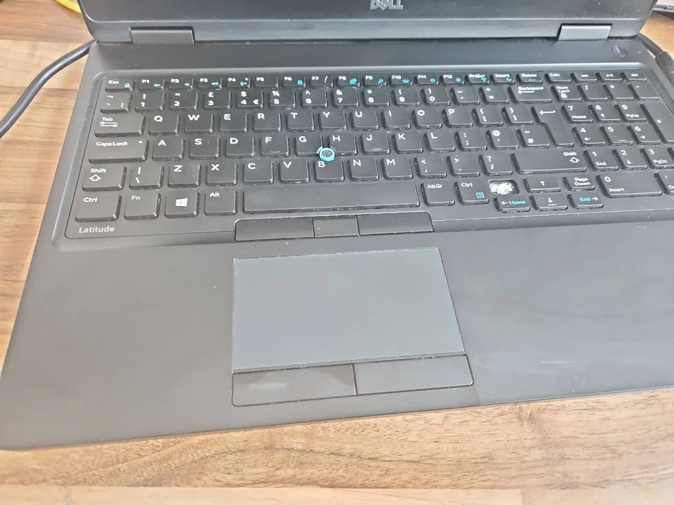 Dell laptop touchpad and keyboard photographed at the PC Repair Guru workshop