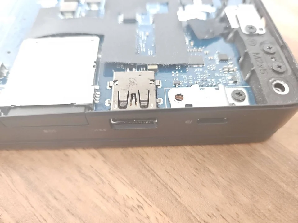 Laptop USB-C Port Not Working? Charging, Display and Data Faults Explained Laptop USB-C port exposed during hardware inspection