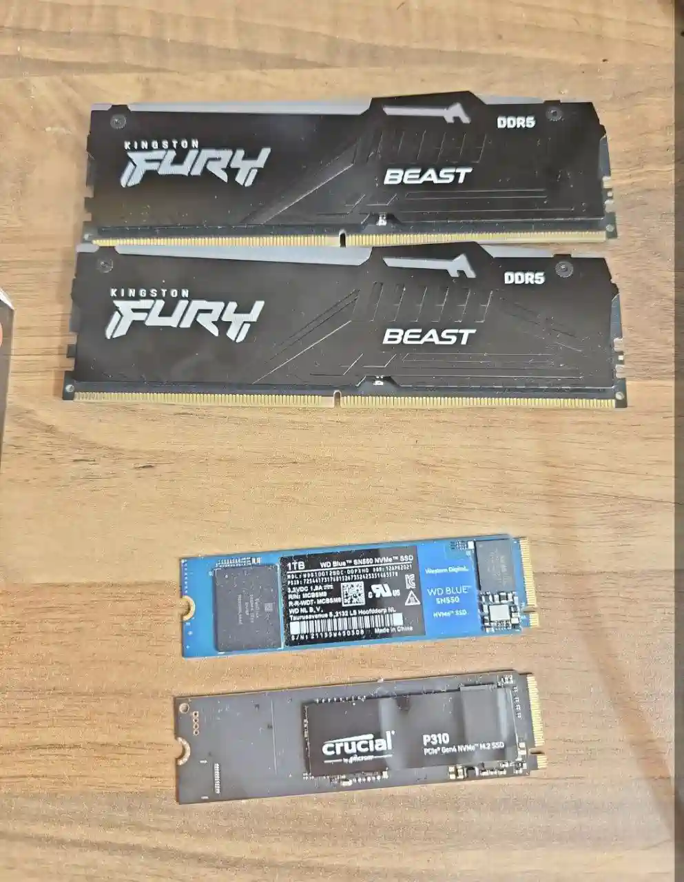Gaming PC parts selected for a custom build including motherboard, RAM, SSD, graphics card and power supply