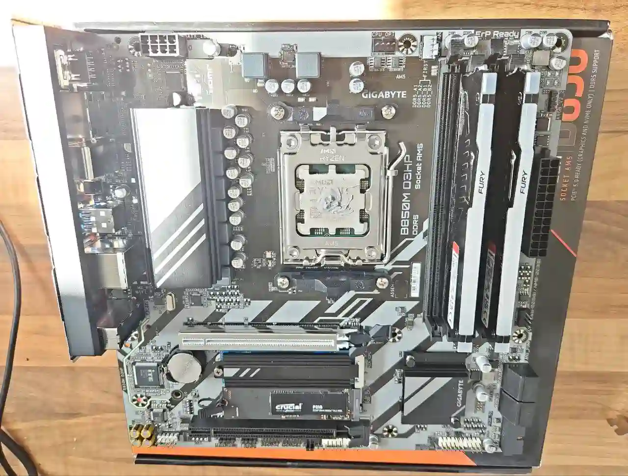Gaming PC upgrade parts including graphics card, motherboard, memory and SSD during custom PC build planning